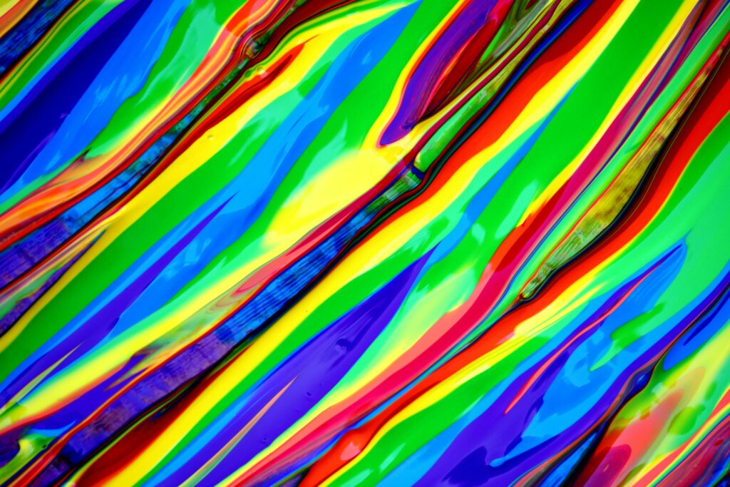 Bright and colorful abstract rainbow painting background with vivid colors.